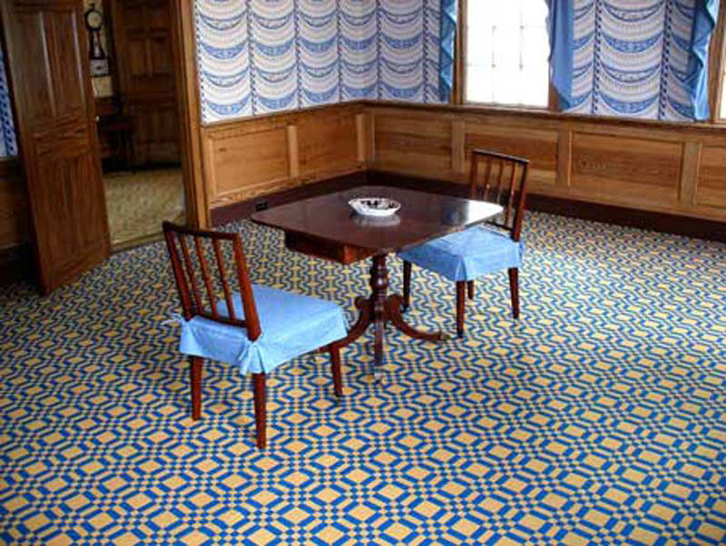Here is one of our geometric ingrain carpets installed wall to wall. This is a larger block pattern, also taken from a historic weaver's draft book.