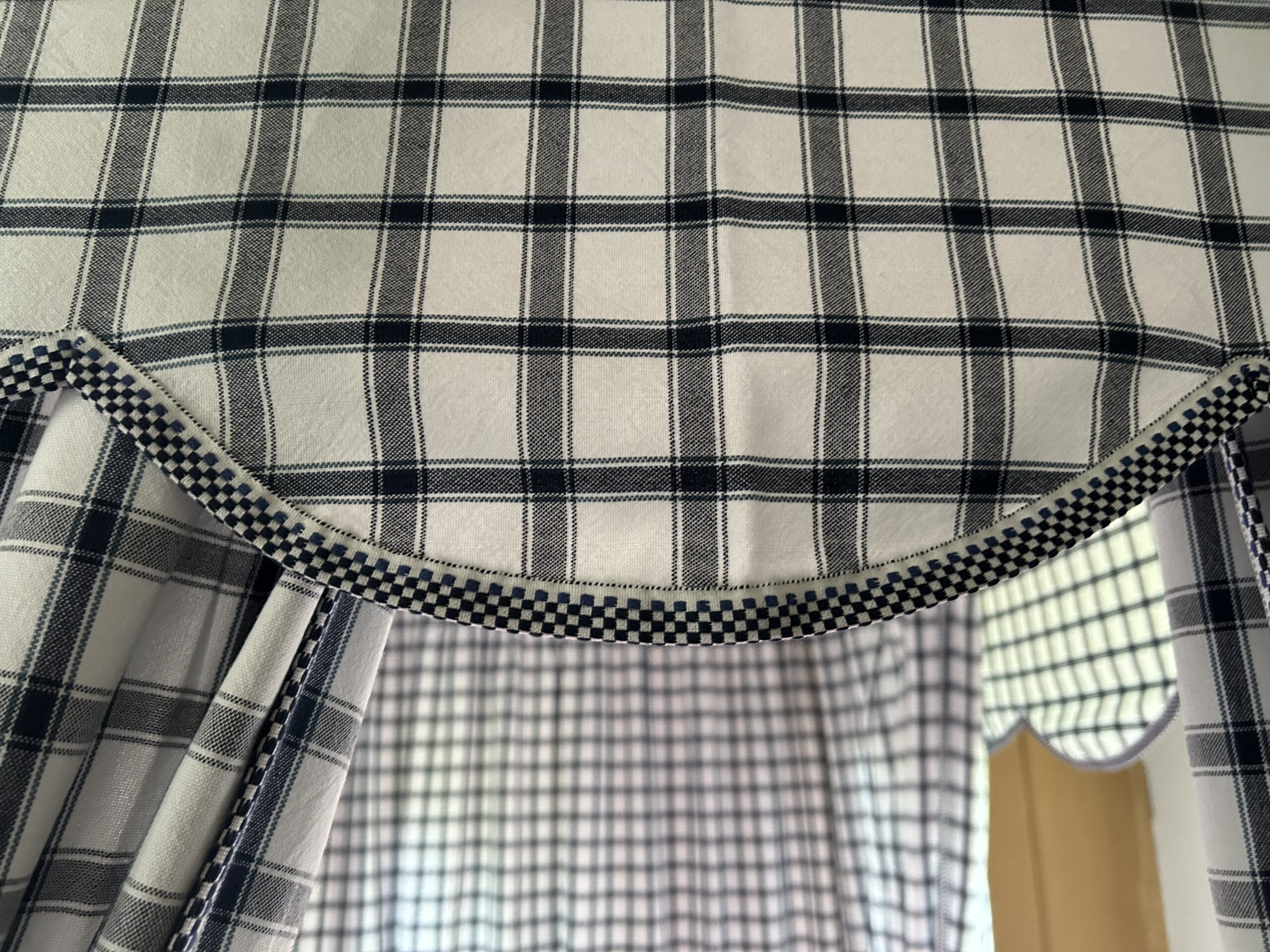 Close up of Daniel Boone Bedhanging with checked trim
