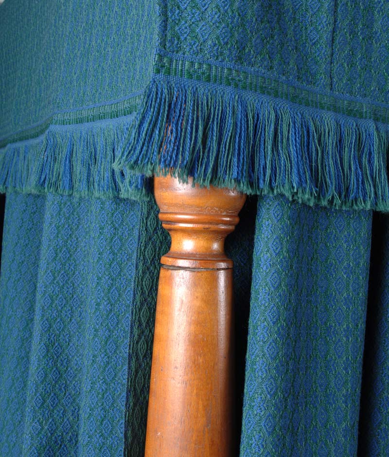 A close-up of the above, showing the hand-woven cut-fringe trim in two colors.