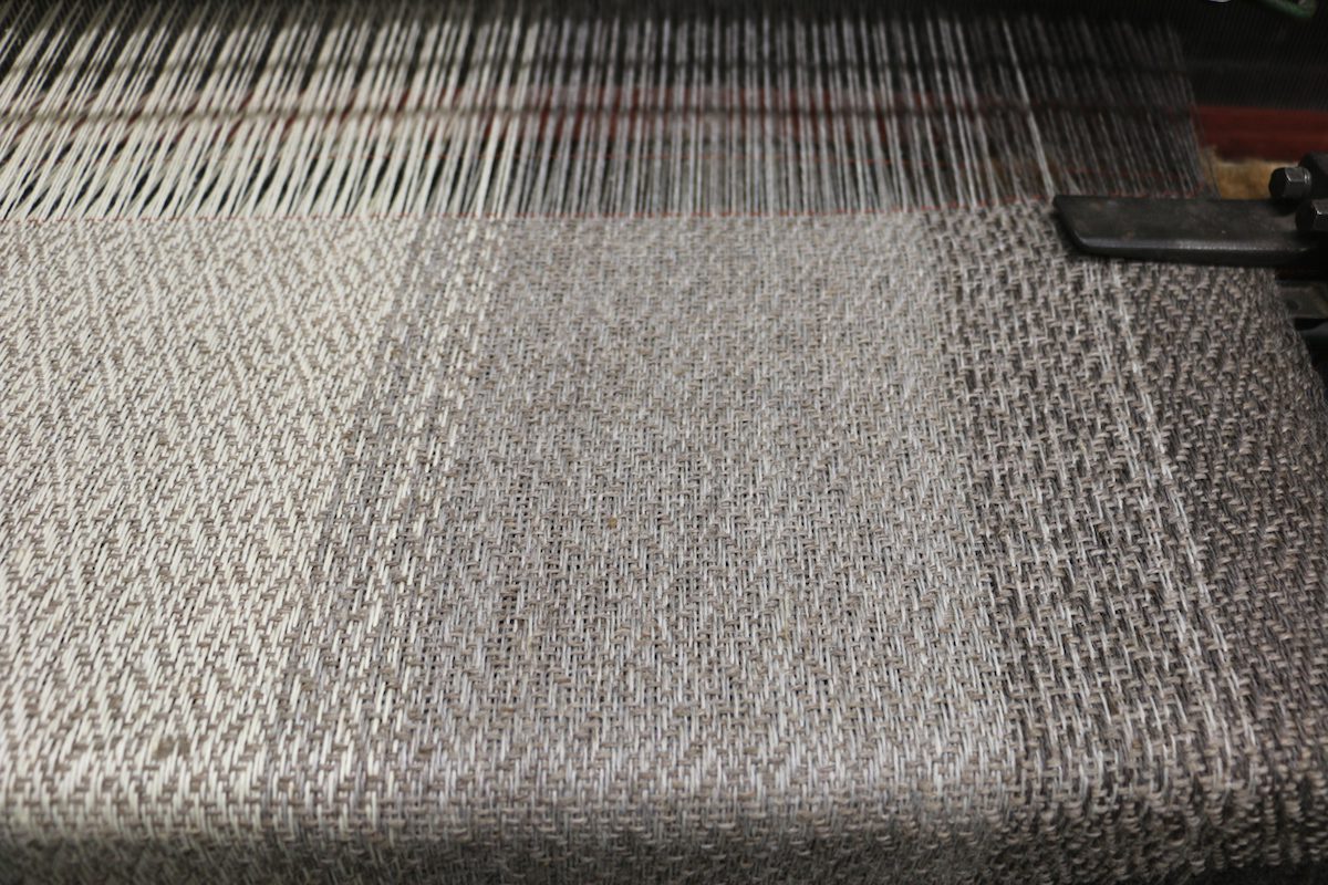Close up of a crepe weave blanket in natural colors from local wool Spun by Battenkil Fibers.