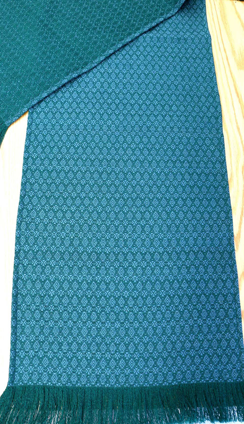 Runner in green and blue figured worsted hearts and diamonds.