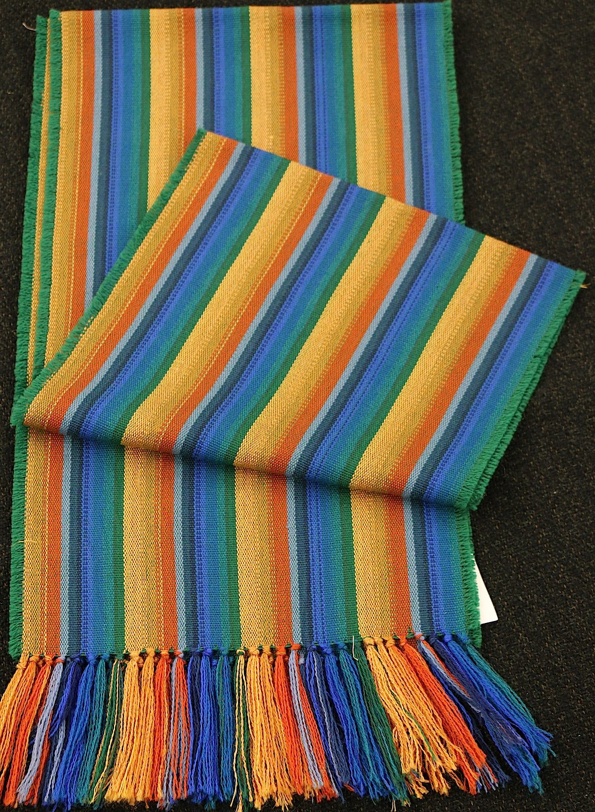 This is a rainbow scarf in silk and worsted in a color scheme that was popular in the 1840's for drapery.