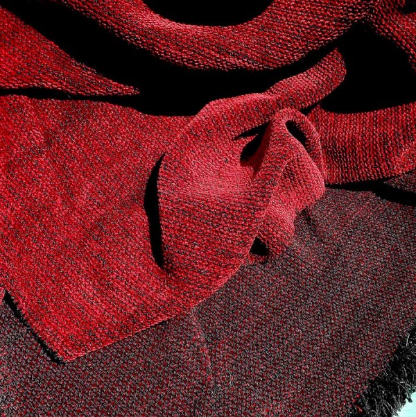 This chenille fabric is a heavy but soft and drapey wool and rayon chenille fabric for luxury throws and blankets. It is woven in a crepe weave.
