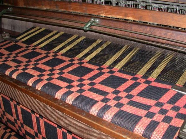 Geometric ingrain carpet on the loom