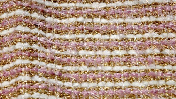 This is a very glittery  upholstery fabric using pink and ivory plush and our very sparkly gold. These fabrics are designed to accent rooms in pillows and accessories.