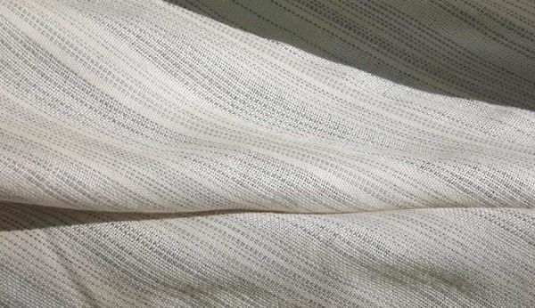 A sheer, 100% alpaca fabric used for drapery. Soft and hypoallergenic, it creates a beautiful window treatment.